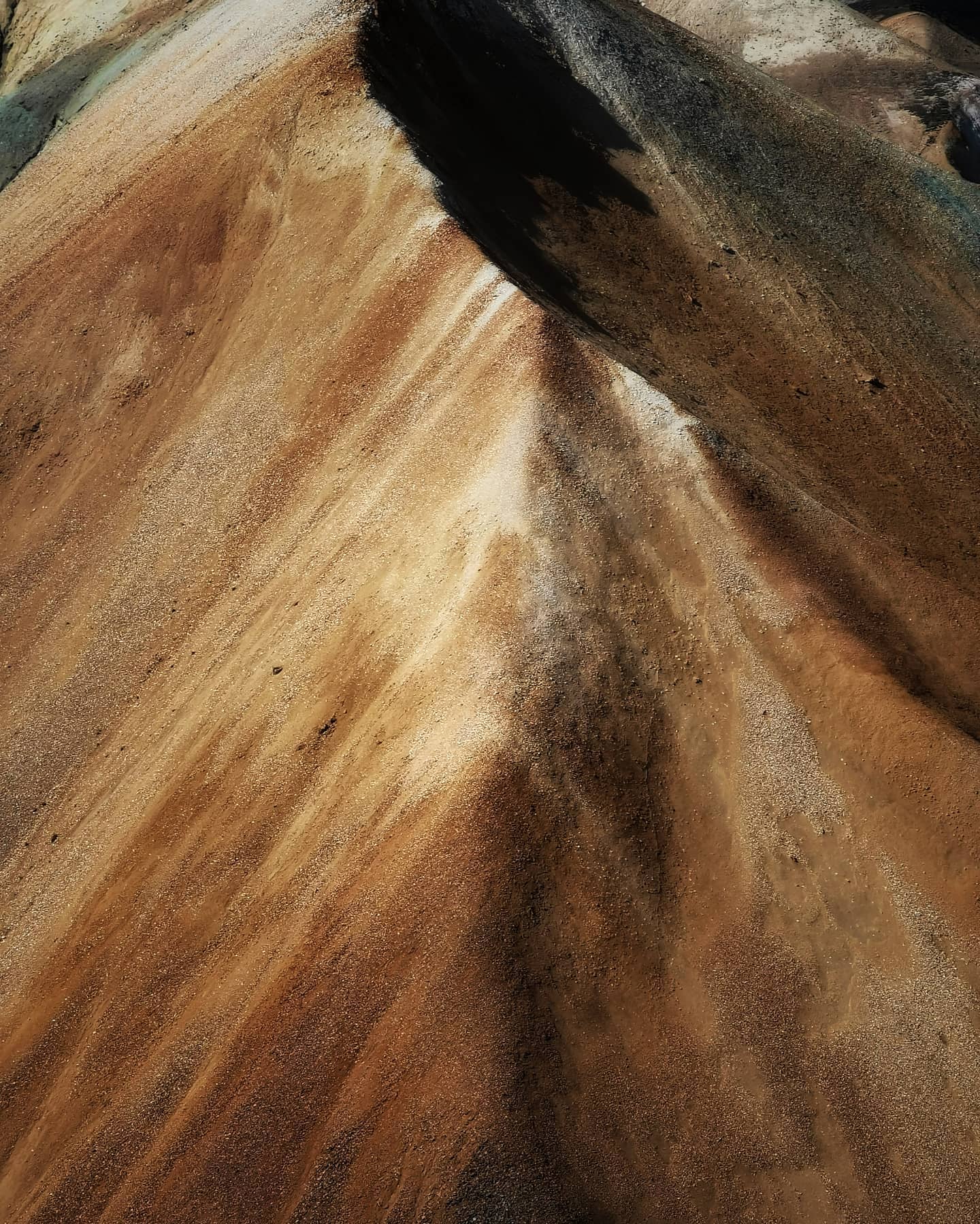 Wind-carved ridges in golden sand
